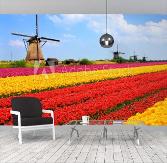 Bild på Vibrant tulips fields with windmills Netherlands